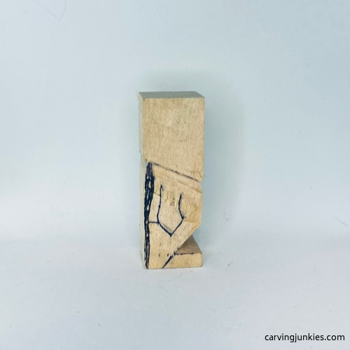 Right arm is drawn on tiny-wood-carving-tiny wood carving man