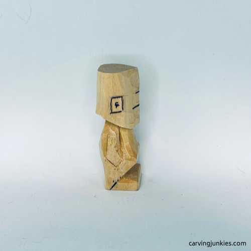 Right ear is marked on tiny wood carving