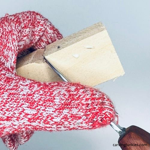 Making a stop cut on tiny wood carving