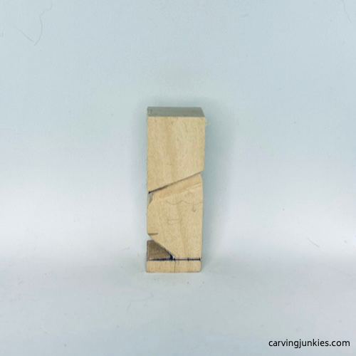 Legs are cut on tiny wood carving man