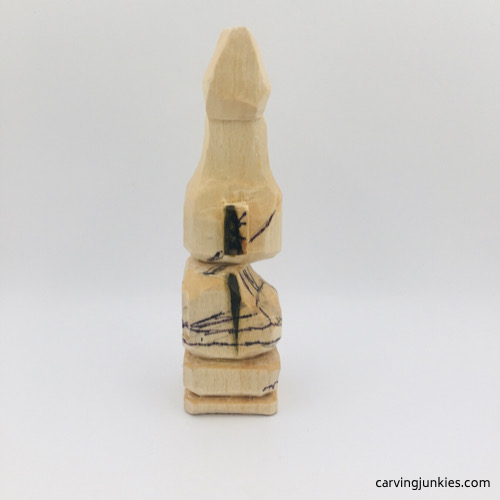 Right view of bikini on troll wood carving Right side of bikini on troll wood carving