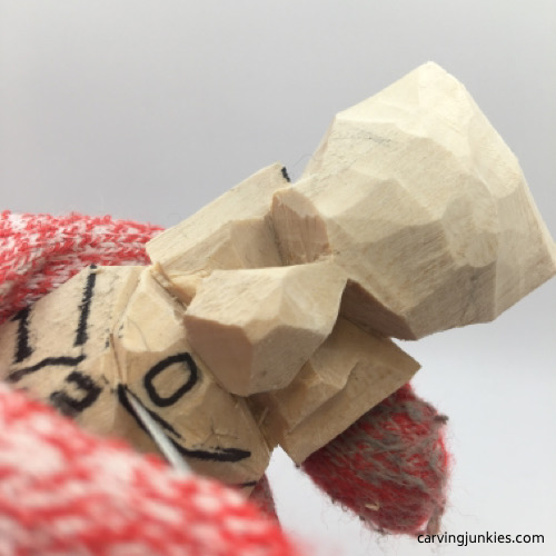 Carving chin on troll carving