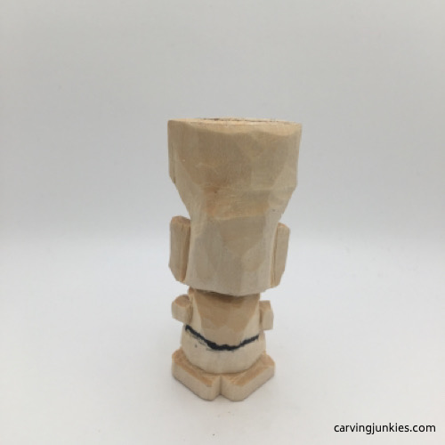 Back view of carved wood troll