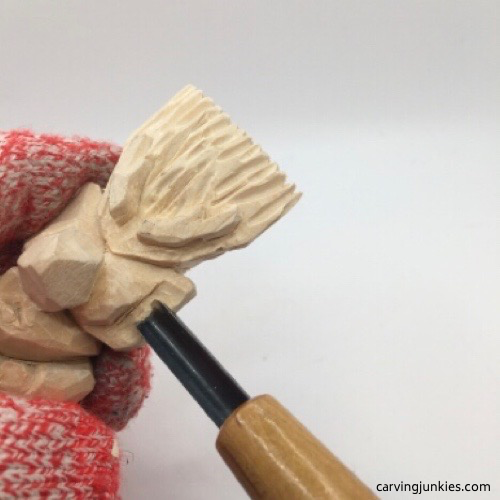 Laminated U gouge on troll carving