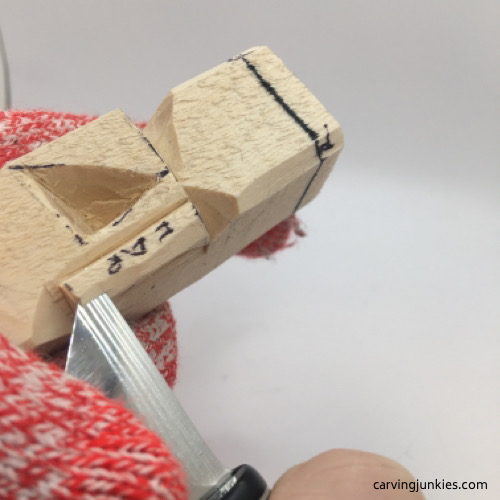 Shaping ear on troll carving