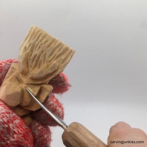 Cutting eyes on troll carving