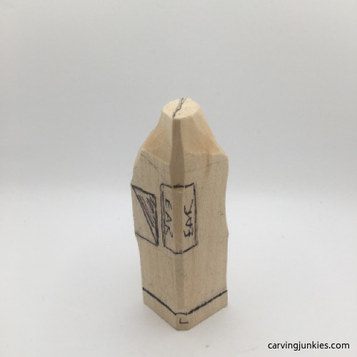 Left view of troll head carved