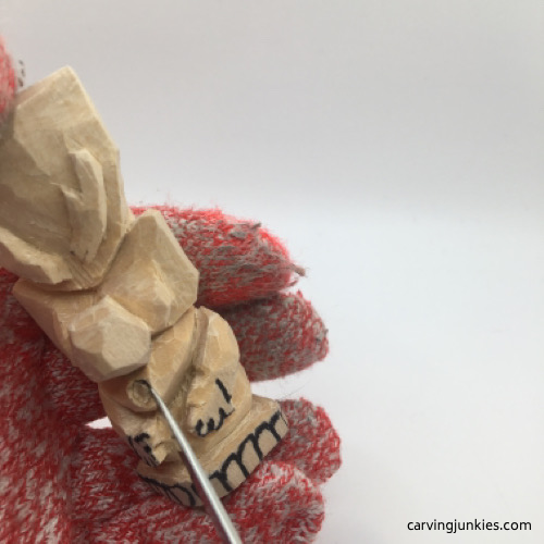 Carving mouth on troll carving