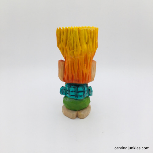 Back side of painted wooden troll carving