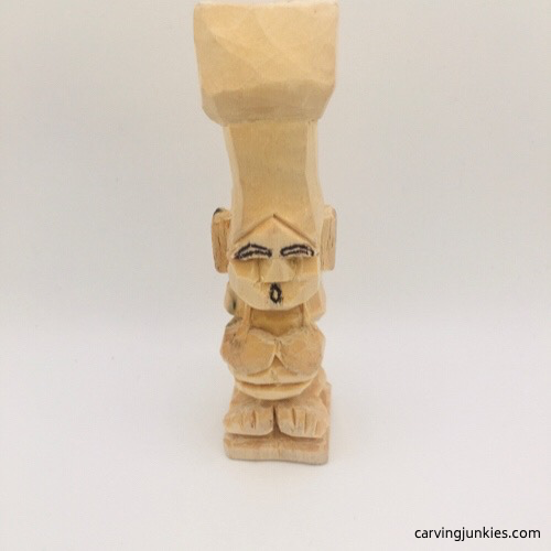 Drawn eyebrows on troll wood carving Drawn mount on troll wood carving