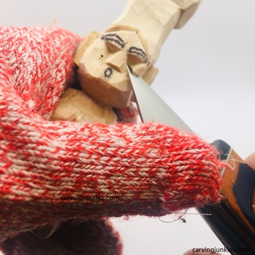 Carving cheeks on troll wood carving Shaping cheeks on troll wood carving