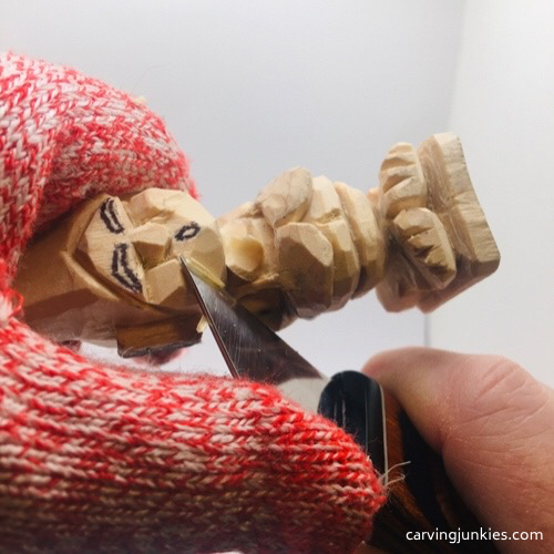 Cutting chin on troll wood carving Carving chin on troll wood carving