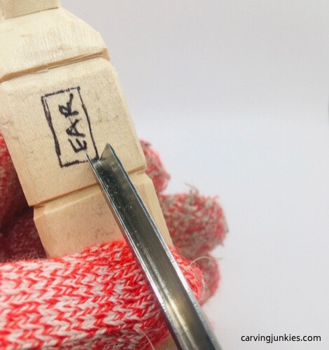 Cutting ear on troll wood carving Using gouge on troll wood carving