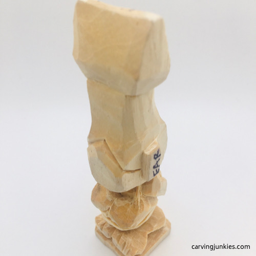 Carved toes on troll wood carving Completed feet on troll wood carving