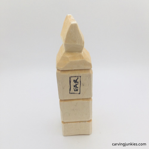 Side view of hair in progress on troll wood carving Progress photo of hair on troll wood carving