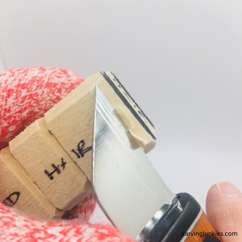 Starting hair on troll wood carving Cutting hair on troll wood carving