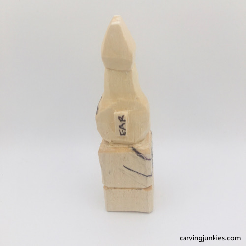 Left progress of troll wood carving Left view of troll wood carving