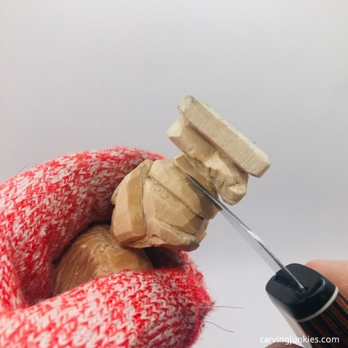 Cutting bottom of bikini on troll wood carving Carving bikini bottom on troll wood carving