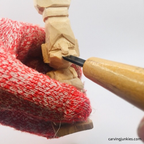 Gouge on troll wood carving Carving mouth on troll wood carving