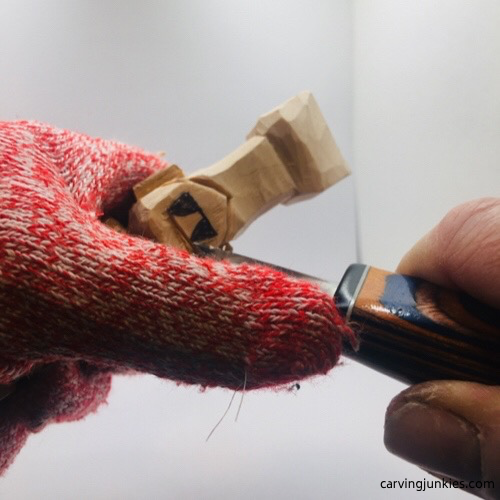 Making pyramid cut on troll wood carving First part of pyramid cut on troll wood carving