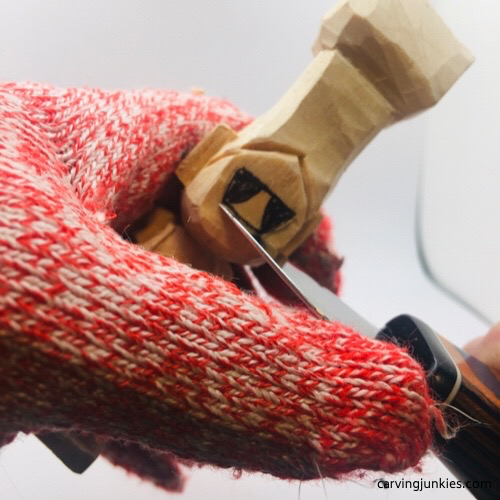 Carving nose on troll wood carving Starting nose on troll wood carving