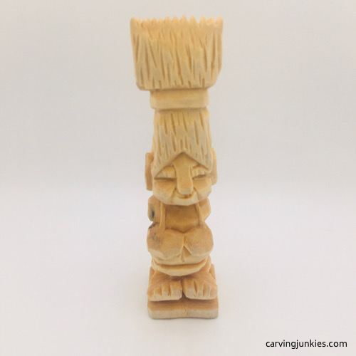 Front view of unfinished troll wood carving Unfinished troll wood carving