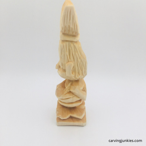 Left side of unfinished troll wood carving Left view of unfinished troll wood carving