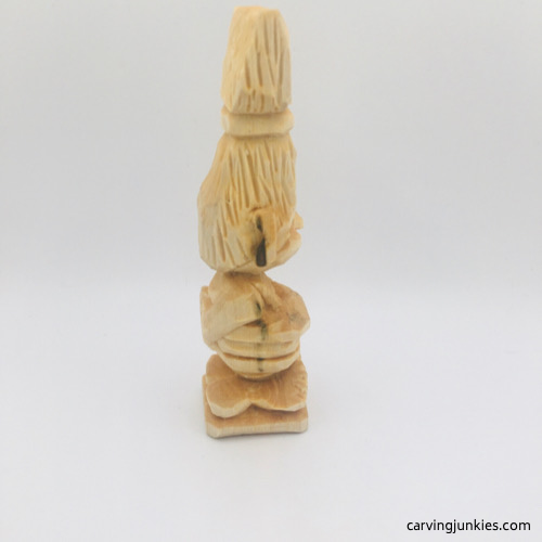 Right side of unfinished troll wood carving Right view of unfinished troll wood carving