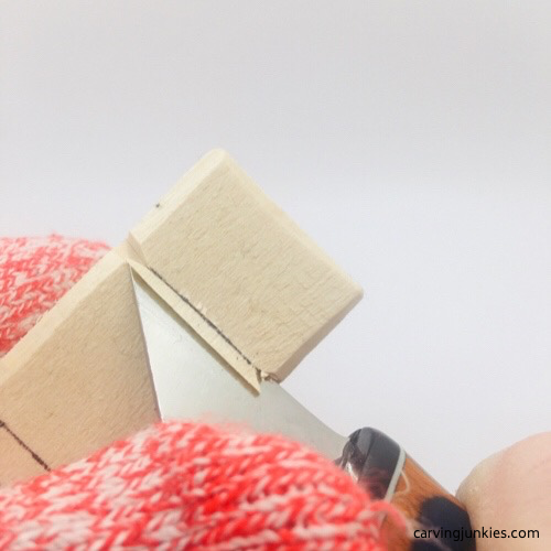 Removing wood under cut for troll wood carving Removing wood under a stop cut