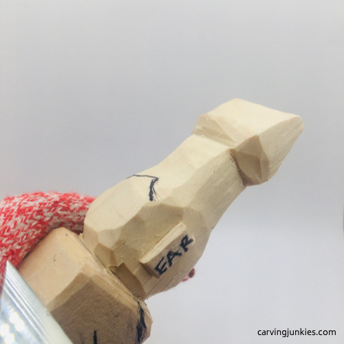 Carving arms on troll wood carving Shaping arms on troll wood carving