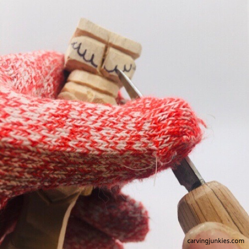 Cutting toes on the troll wood carving Carving toes on the troll wood carving
