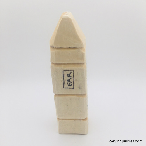 Hair in progress on troll wood carving Side view of hair on troll wood carving