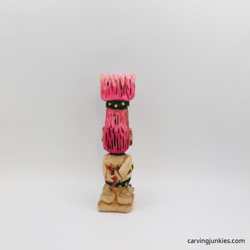 Painted troll wood carving from back Back view of painted troll wood carving