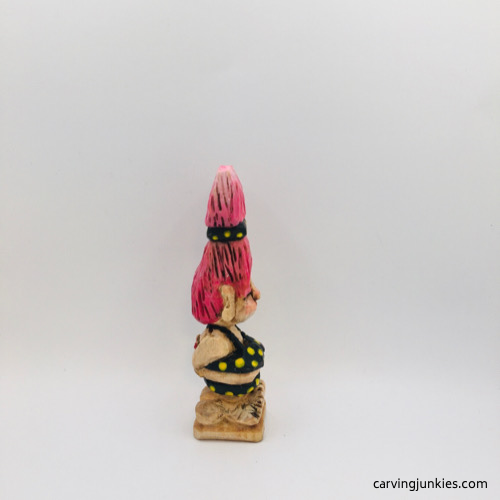 Right side of painted wooden troll Right view of painted troll wood carving