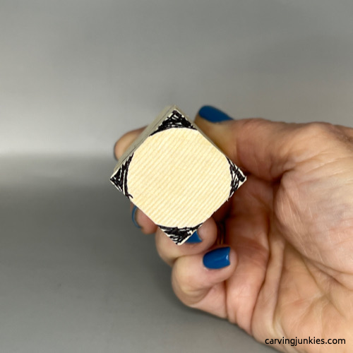 Circle is sketched on bottom of Valentine heart wood carving