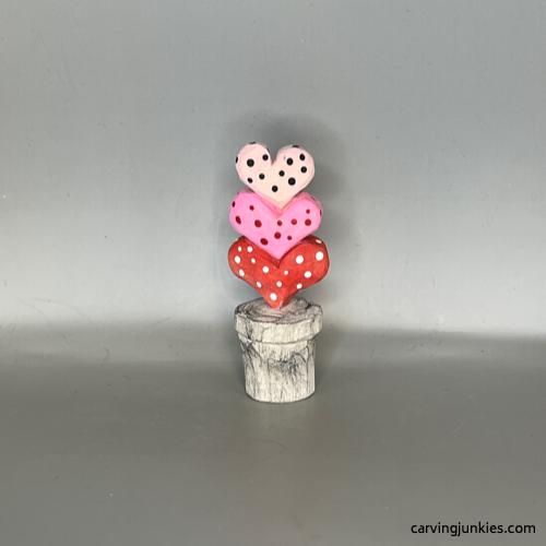 Front view of painted Valentine heart wood carving