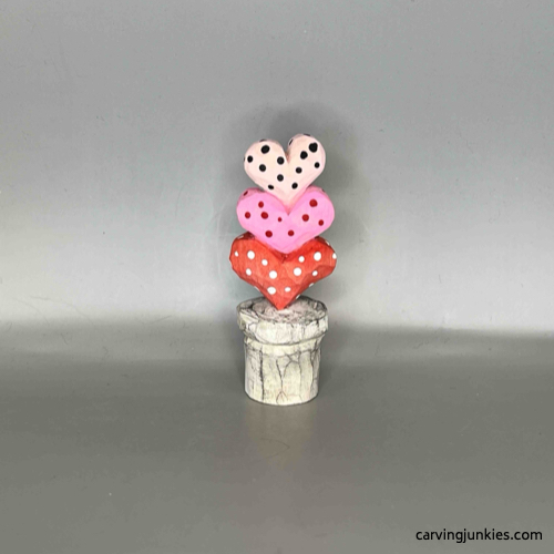 Painted back of Valentine heart wood carving