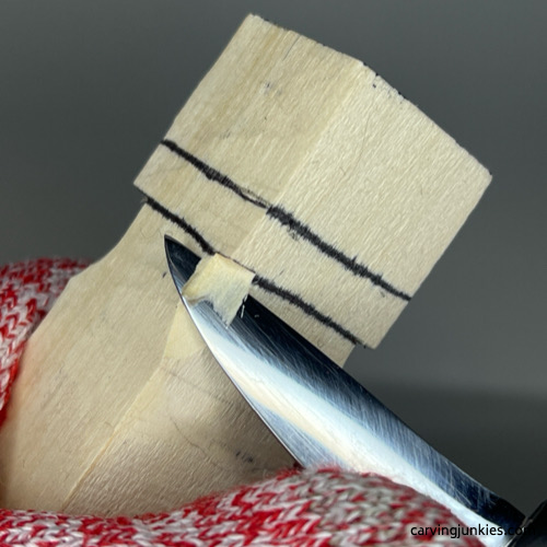 Making a stop cut on Valentine heart wood carving