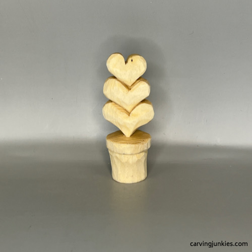 Front view of unpainted Valentine heart wood carving