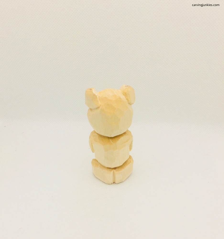 Back view of completed whittled bear
