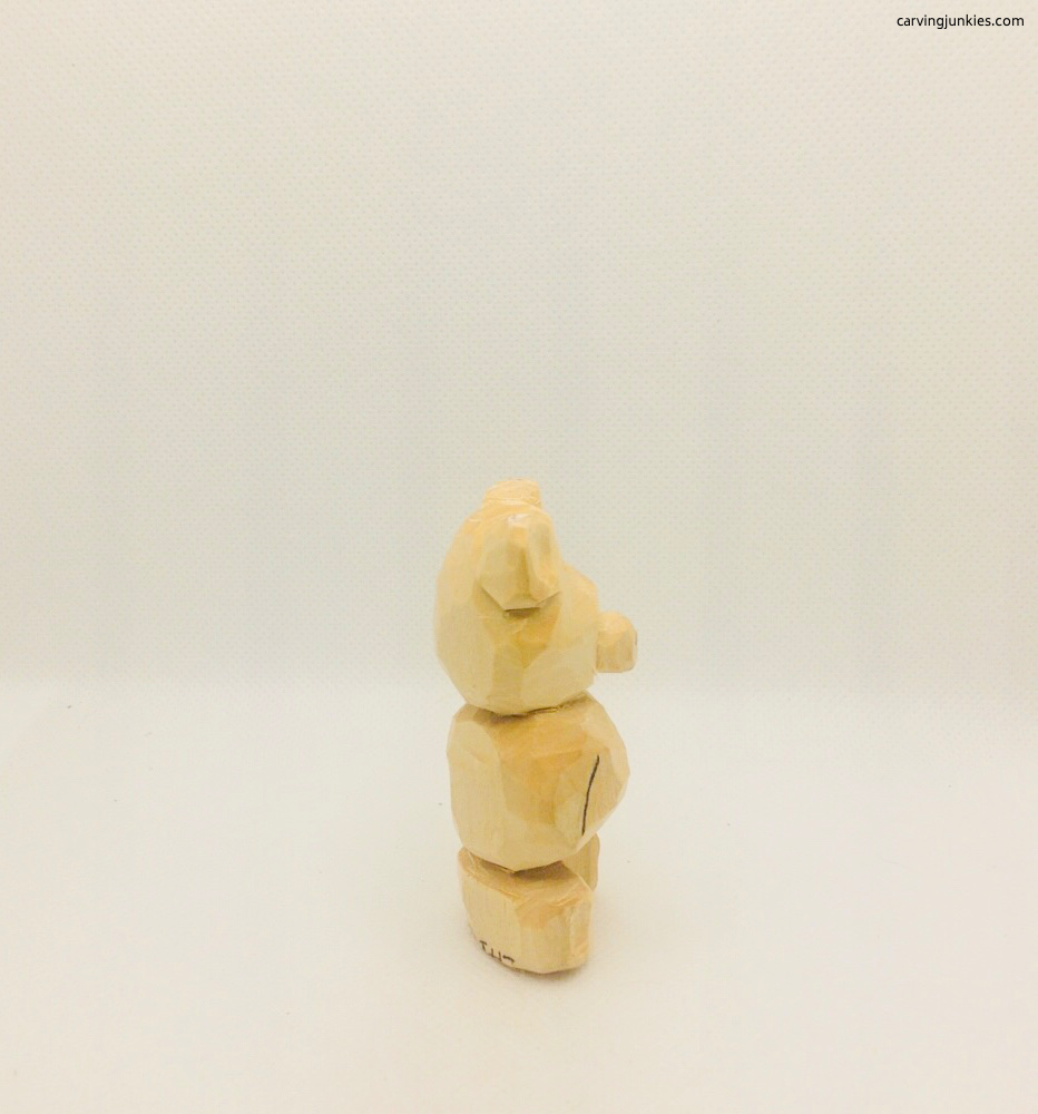 Right view of cut ears on bear whittling