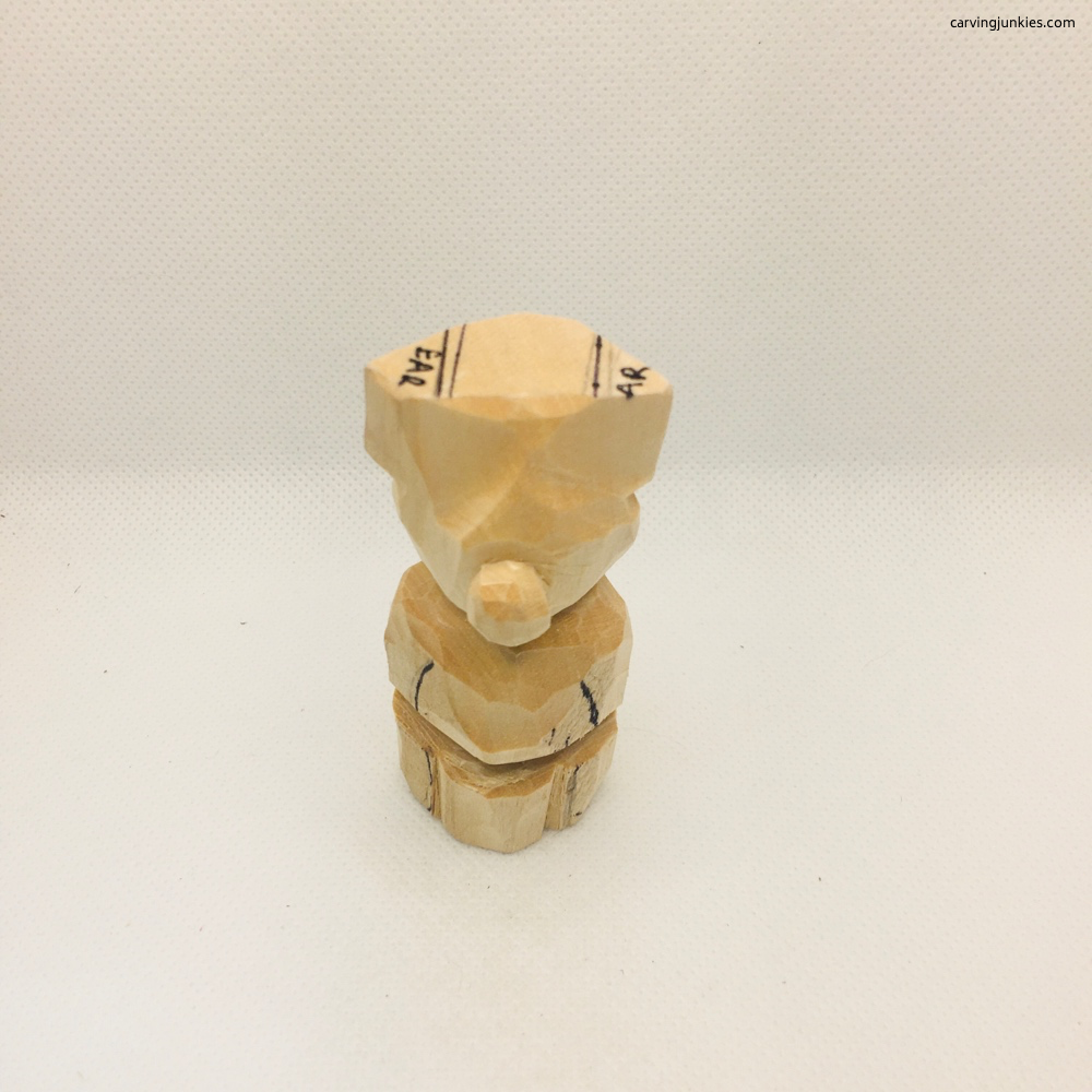 Whittling lower legs of bear