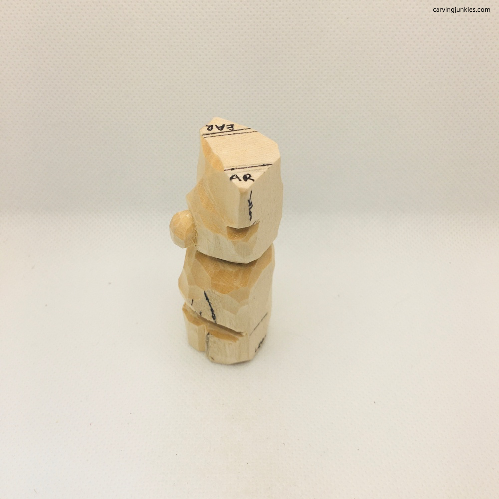 Left view of lower legs of whittled bear