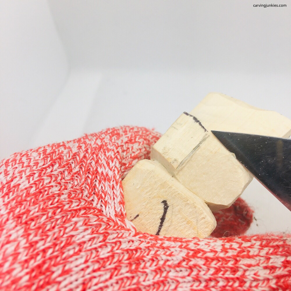 Making cut on bear whittling