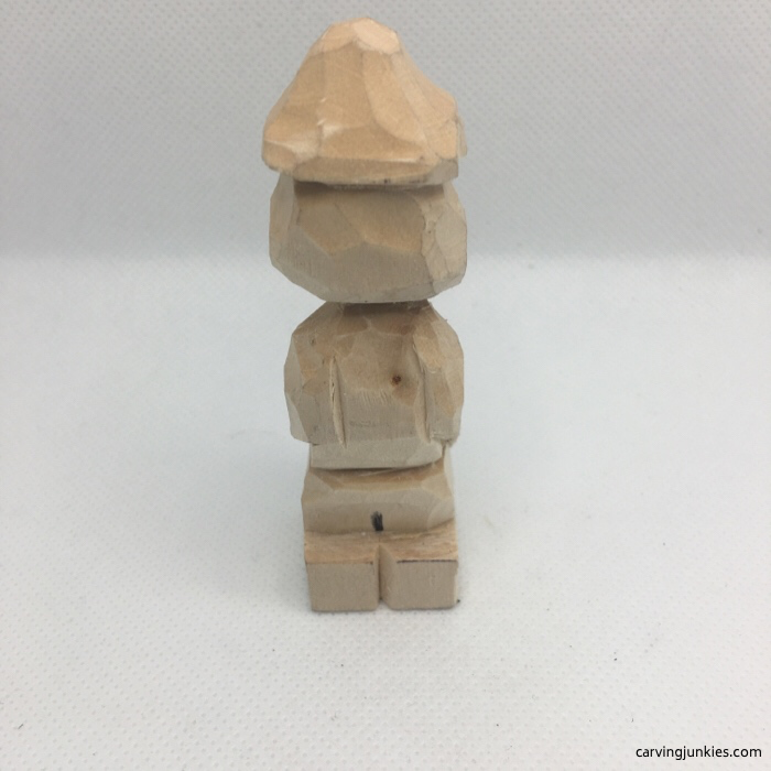 Arms cut on back of wood carving