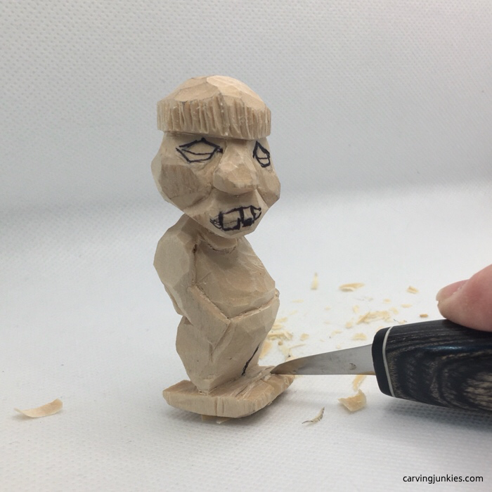 Face drawn on caricature carving