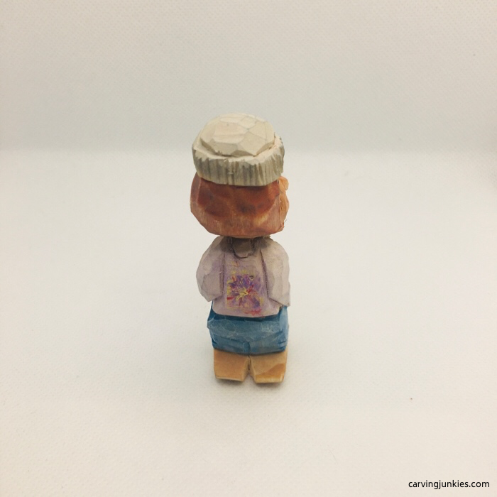 Tie dye design on wood carving