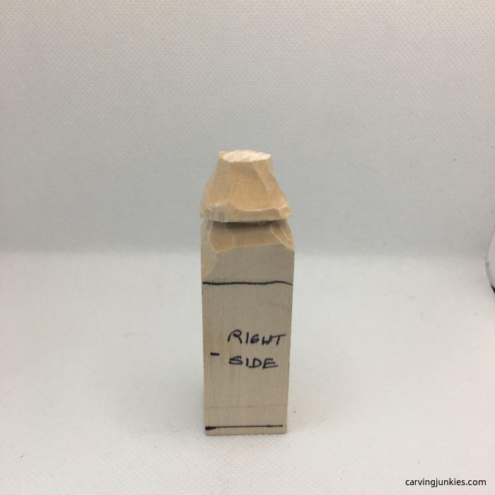 Right side of hat on caricature carving