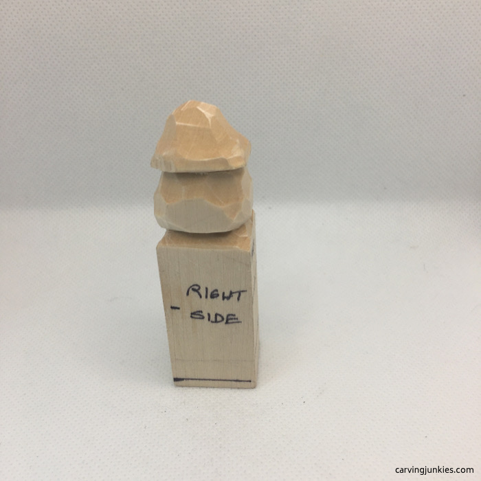 Hat and head separated on wood carving