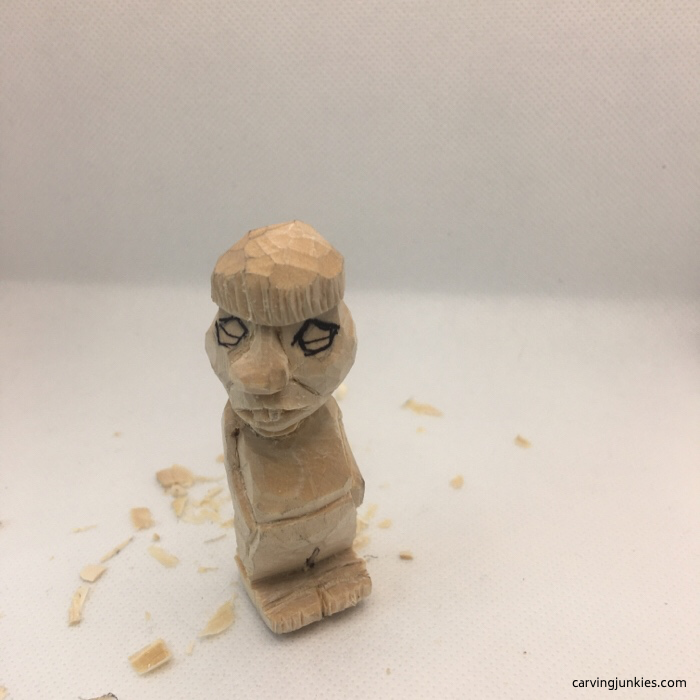 Eye added to wood carving